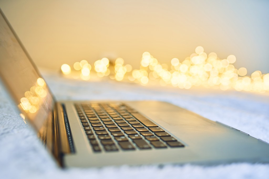 Laptop with blank screen with sparkles