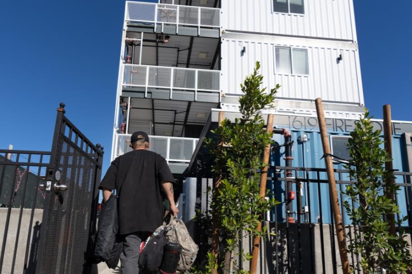 Funding to Preserve Existing Homes man walking to a home